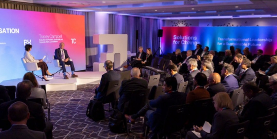 Panel discussion on stage at the Solutions for Change Summit in New York City
